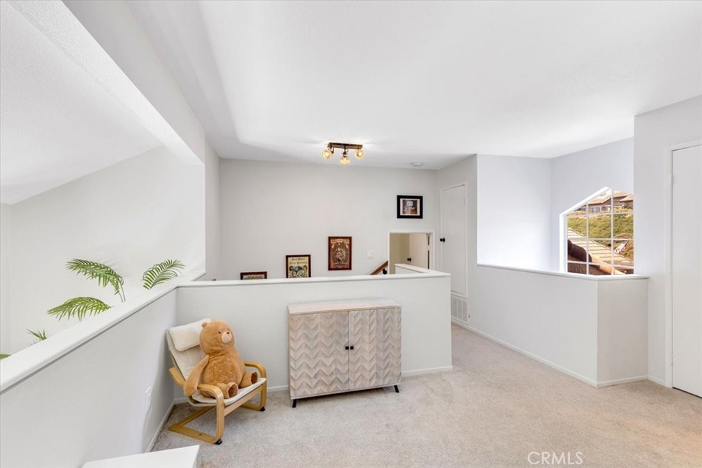 Loft looking towards the stair and storage area/room. - 27355 Paseo Laguna, San Juan Capistrano CA 92675 - photo 30