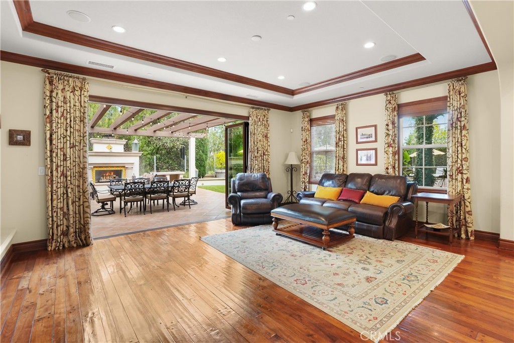 Expansive Cantina doors open effortlessly to the inviting backyard, ideal for indoor-outdoor entertaining. - 27532 Calle De La Rosa, San Juan Capistrano CA 92675 - photo 28