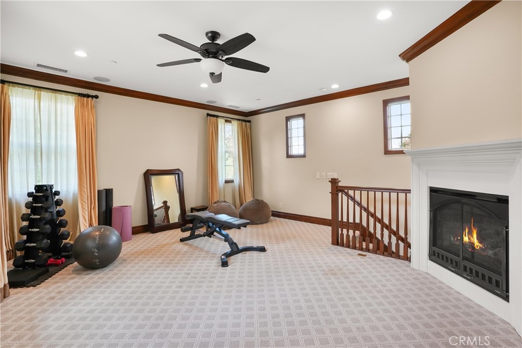 Expansive upstairs loft with fireplace. Ideal as a media room, game room, home office, fitness area, or additional livin - 27532 Calle De La Rosa, San Juan Capistrano CA 92675 - photo 46