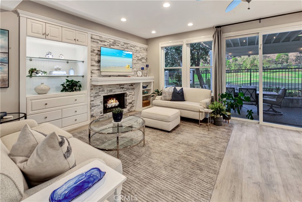 Family room with Custom Tile fireplace and Built-in cabinet - 27941 Via De Costa, San Juan Capistrano CA 92675 - photo 10