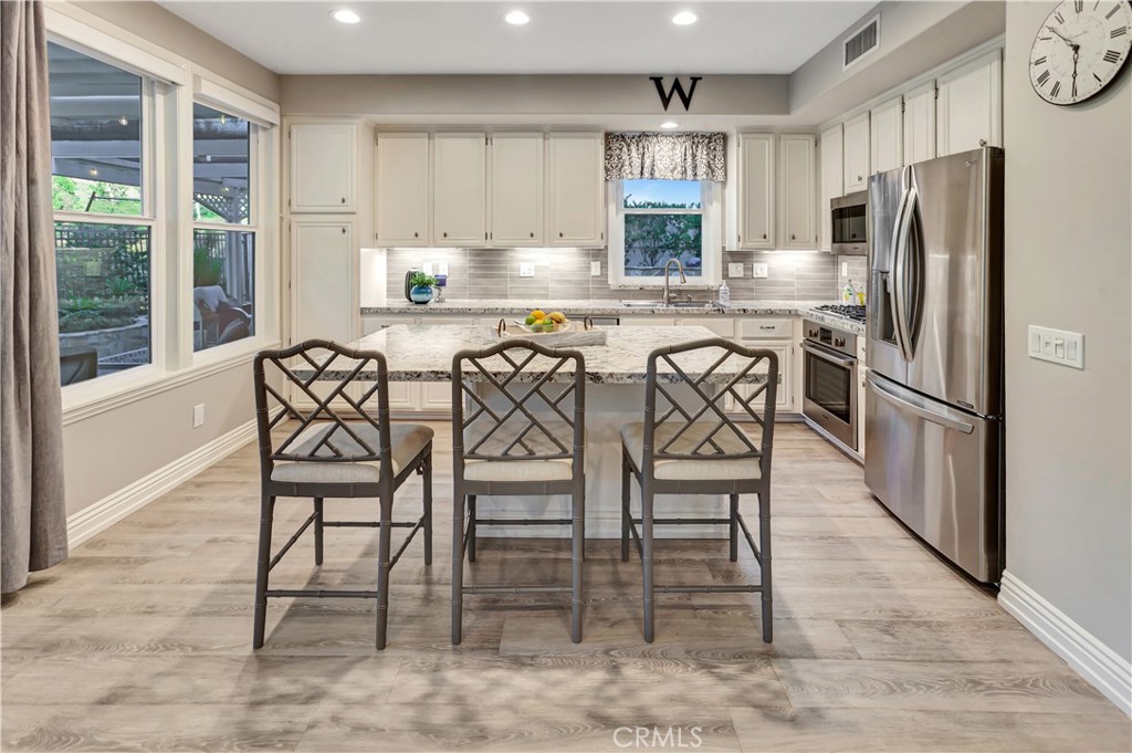 Remodeled kitchen with Granite Counters, Stainless Steel Appliances and Pull-out cabinet drawers - 27941 Via De Costa, San Juan Capistrano CA 92675 - photo 12