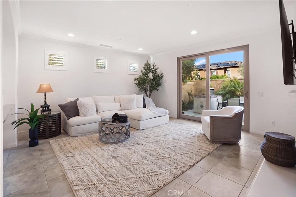 Spacious family room filled with natural light and offering direct access to the outdoor entertaining area. - 28242 Camino Del Rio, San Juan Capistrano CA 92675 - photo 5