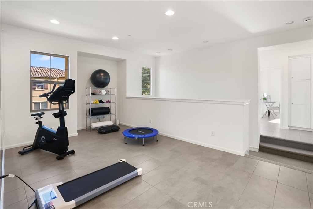 Additional view of the versatile upstairs loft, offering generous space for a home gym, media room, office, or secondary - 28242 Camino Del Rio, San Juan Capistrano CA 92675 - photo 18