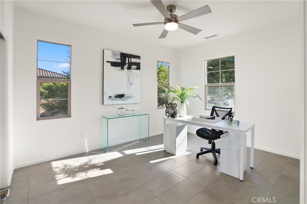 Secondary bedroom shown as a home office, highlighting the room’s flexibility for work or additional living space. - 28242 Camino Del Rio, San Juan Capistrano CA 92675 - photo 24