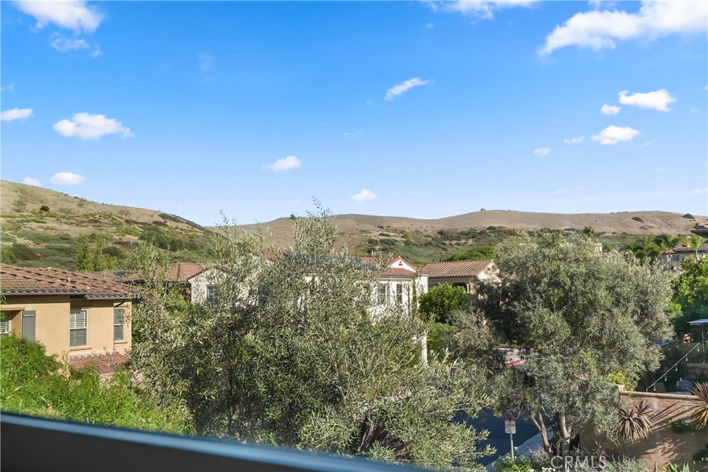 Hillside and neighborhood views enjoyed from the primary bedroom. - 28242 Camino Del Rio, San Juan Capistrano CA 92675 - photo 28