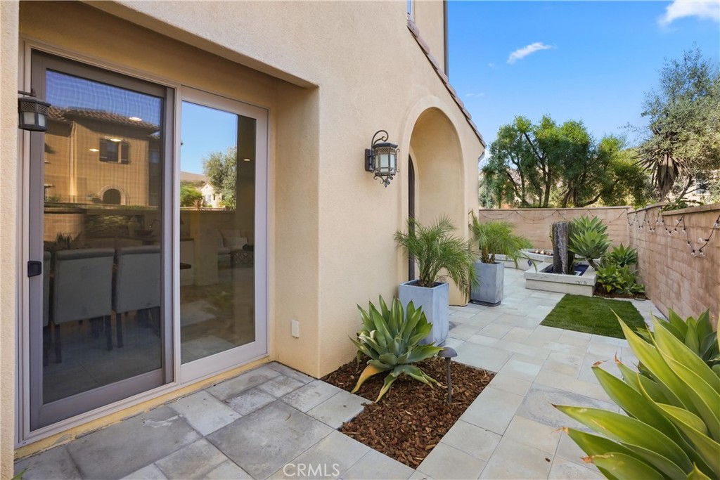 Additional courtyard view highlighting the landscaped outdoor space and direct access to the home. - 28242 Camino Del Rio, San Juan Capistrano CA 92675 - photo 39