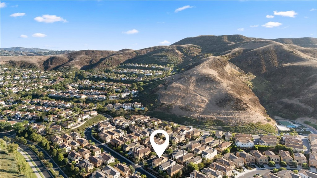 Aerial neighborhood view highlighting the home’s location among the surrounding rolling hills. - 28242 Camino Del Rio, San Juan Capistrano CA 92675 - photo 42