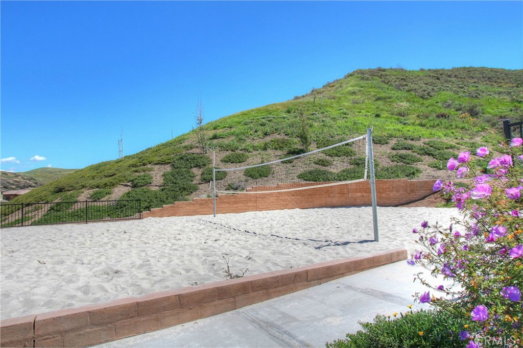 Community sand volleyball court surrounded by the natural hillside setting. - 28242 Camino Del Rio, San Juan Capistrano CA 92675 - photo 48