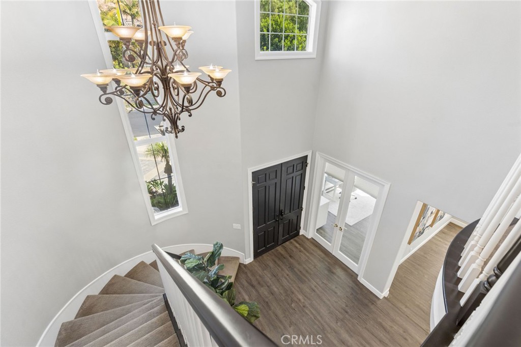 Head up the grand staircase to 4 more bedrooms, plus a large loft - 28382 Calle Pinon, San Juan Capistrano CA 92675 - photo 43