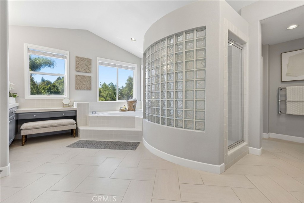 Beautiful large bathroom with separate jetted tub, glass walled shower, separate toilet room with bidet, 2nd laundry clo - 28382 Calle Pinon, San Juan Capistrano CA 92675 - photo 50
