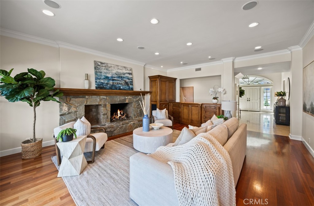 Family room with raised hearth wood burning fireplace - 29902 Hillside Terrace, San Juan Capistrano CA 92675 - photo 11