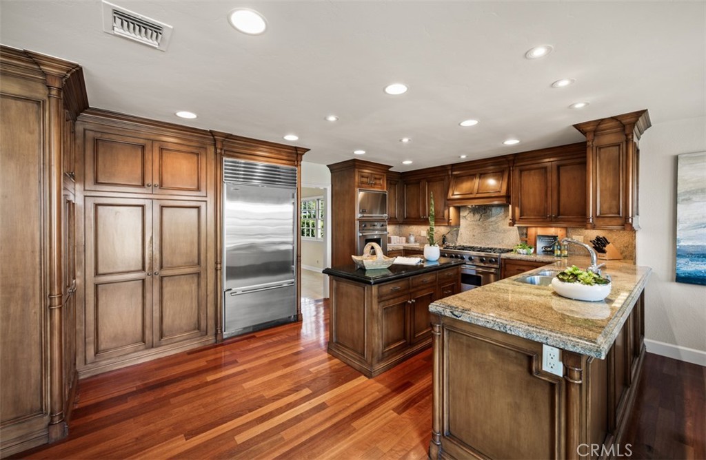 Kitchen open to family room - 29902 Hillside Terrace, San Juan Capistrano CA 92675 - photo 14