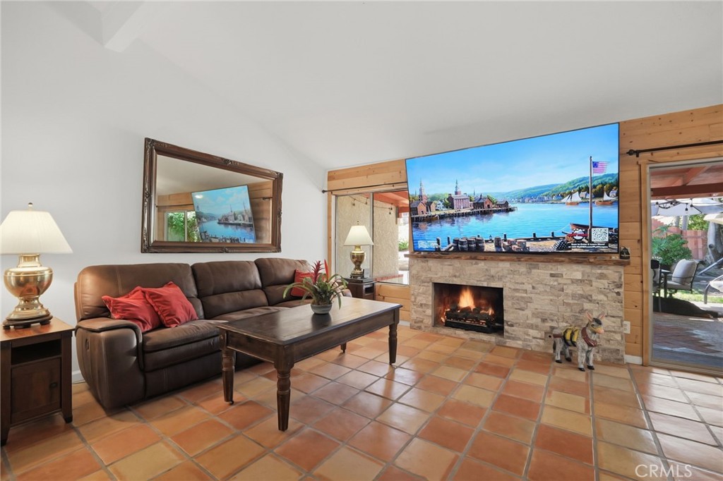 Digitally altered photo. Fire in fireplace. - 31092 Calle Santa Rosalia, San Juan Capistrano CA 92675 - photo 5