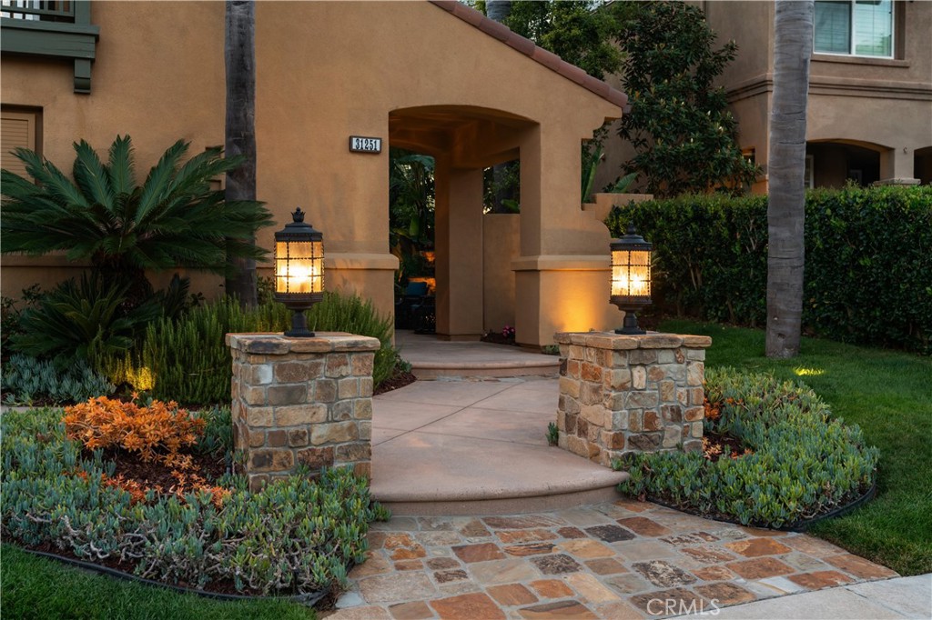 Beautifully landscaped entry with stone accents and ambient lighting - 31251 Calle Bolero, San Juan Capistrano CA 92675 - photo 2