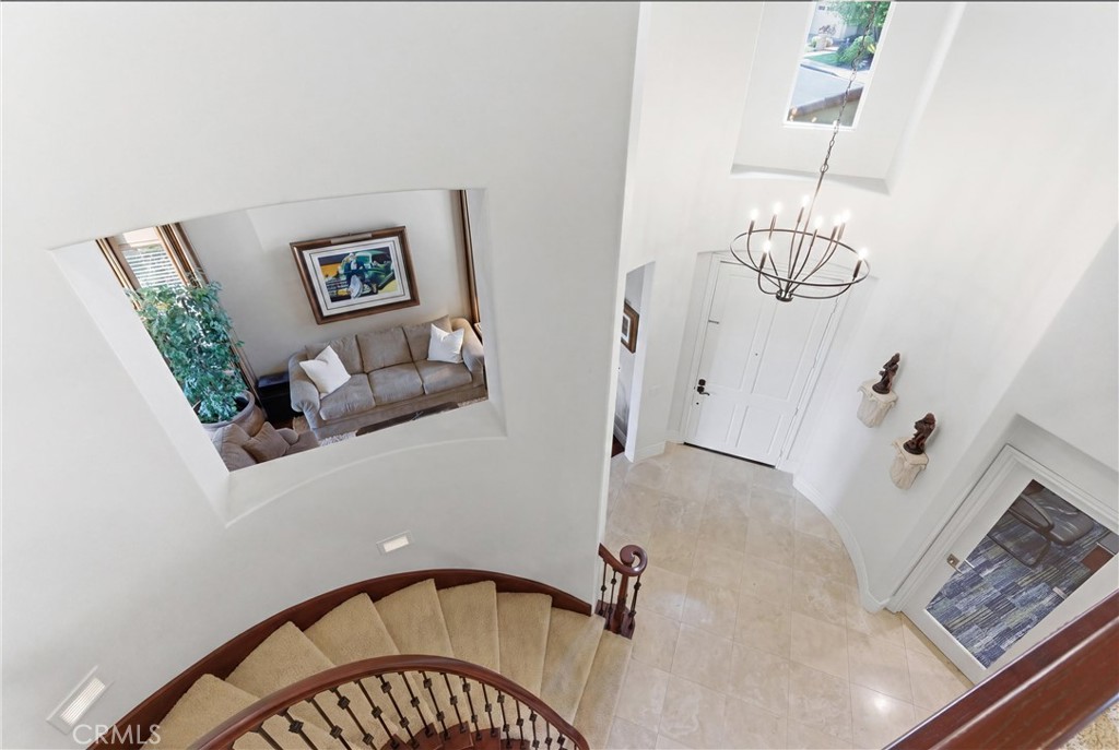 Dramatic entry with soaring ceilings and elegant staircase detailing - 31251 Calle Bolero, San Juan Capistrano CA 92675 - photo 42