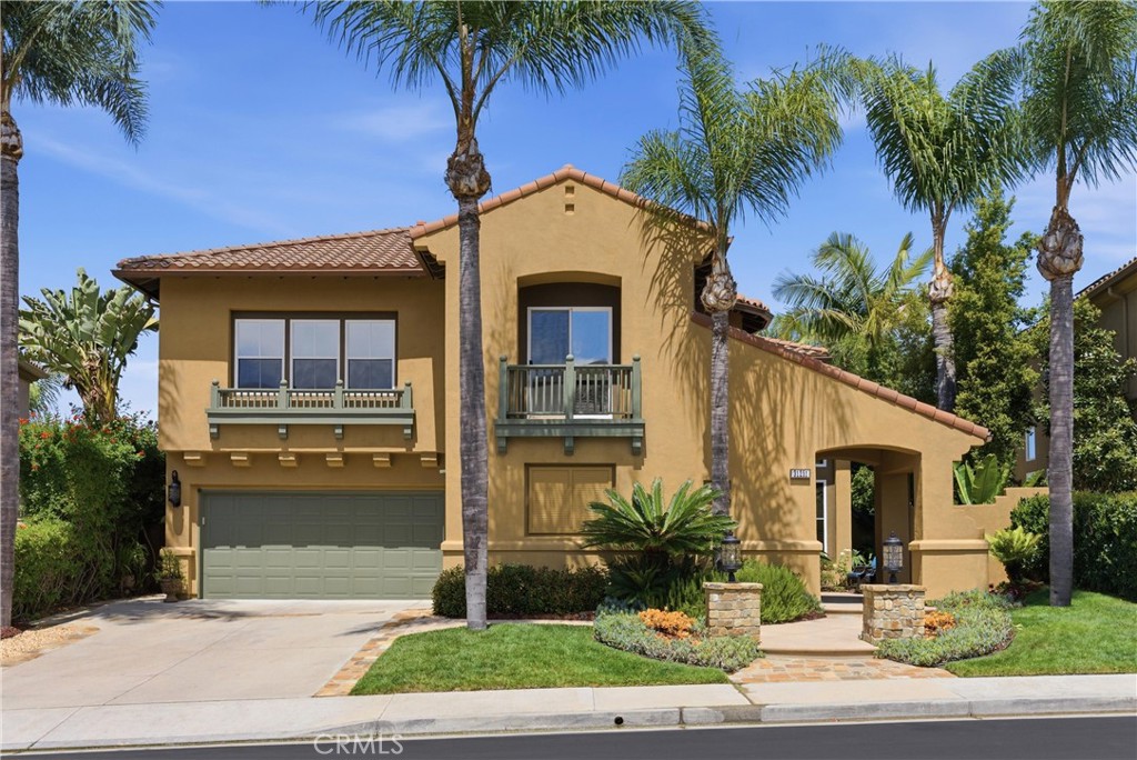 Elegant exterior with manicured landscaping and inviting curb appeal set along a quiet interior street - 31251 Calle Bolero, San Juan Capistrano CA 92675 - photo 72