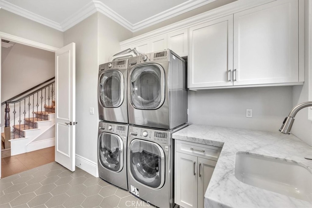 Interior Laundry Room on main level. Second staircase to the upper level. - 31378 Juliana Farms Road, San Juan Capistrano CA 92675 - photo 24