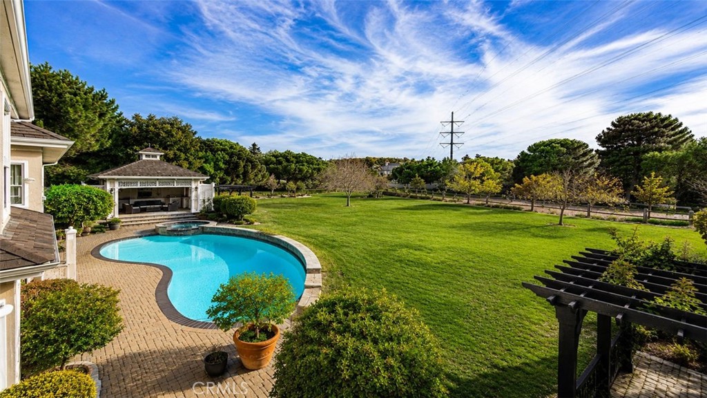 We virtually removed the backyard fencing around the pool so property can be viewed fully. - 31445 Juliana Farms Road, San Juan Capistrano CA 92675 - photo 3