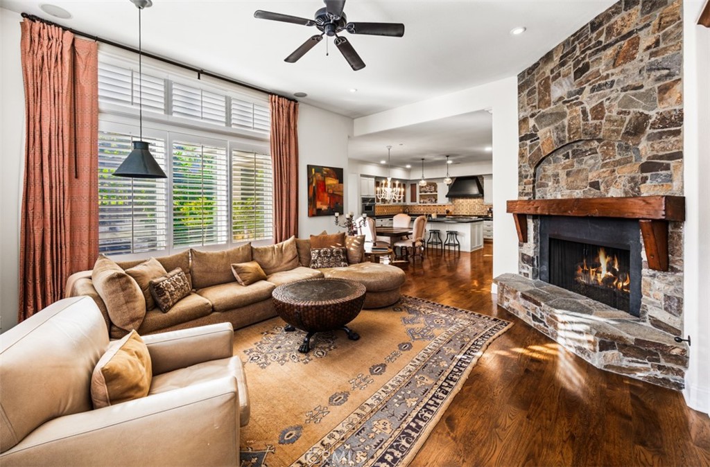 Family room with raised hearth fireplace - 31445 Juliana Farms Road, San Juan Capistrano CA 92675 - photo 24