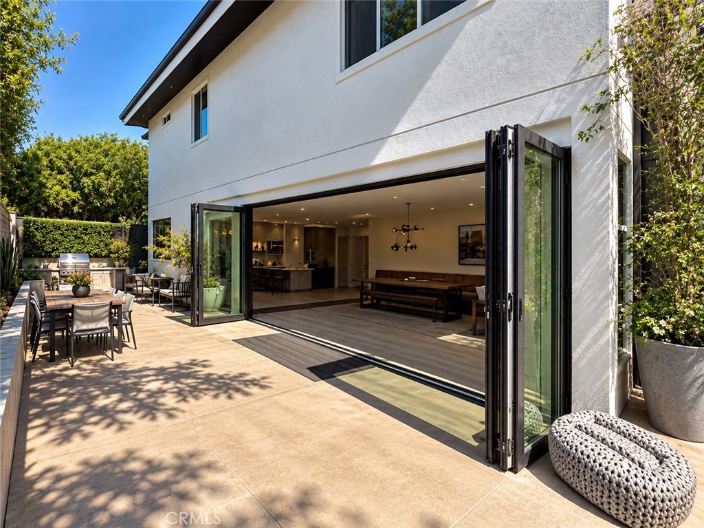 Bi fold doors creating inside/outside living. Photo enhanced. - 31461 Paseo Duran, San Juan Capistrano CA 92675 - photo 4