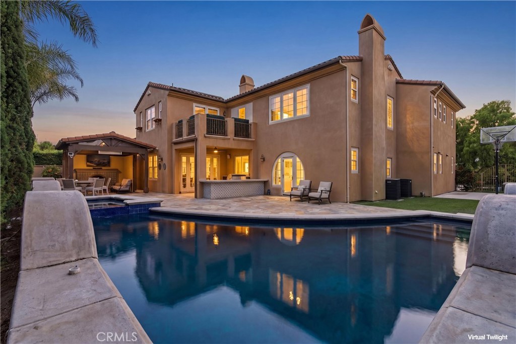 Resort-style backyard designed for elevated entertaining, featuring a sparkling pool and spa, covered outdoor cabana wit - 31491 Carril De Maderas, San Juan Capistrano CA 92675 - photo 2
