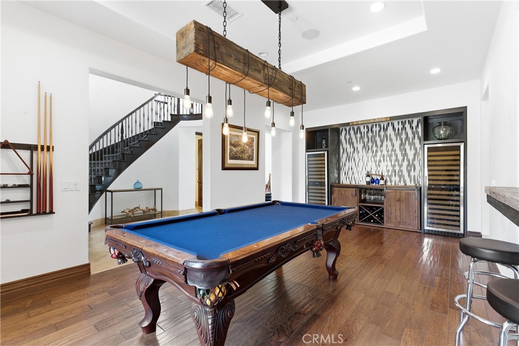 Entertainer’s game room with custom billiards area, rustic beam chandelier, built-in wet bar, dual wine refrigerators, h - 31491 Carril De Maderas, San Juan Capistrano CA 92675 - photo 12