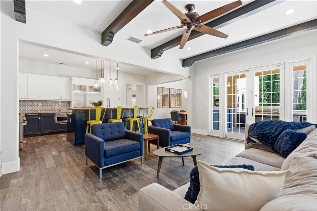 Bright and airy great room with French doors, exposed beam ceilings, designer lighting, and seamless indoor-outdoor Cali - 31491 Carril De Maderas, San Juan Capistrano CA 92675 - photo 17