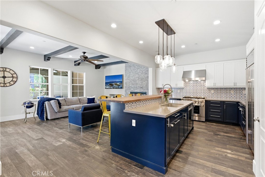 Custom chef’s kitchen with farmhouse-inspired butcher block island, prep sink, stainless steel appliances, recessed ligh - 31491 Carril De Maderas, San Juan Capistrano CA 92675 - photo 19