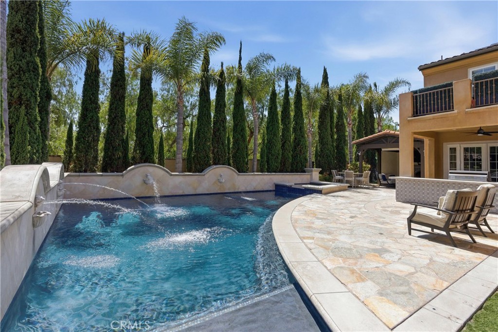 Private backyard framed by mature palms and towering cypress trees - 31491 Carril De Maderas, San Juan Capistrano CA 92675 - photo 27