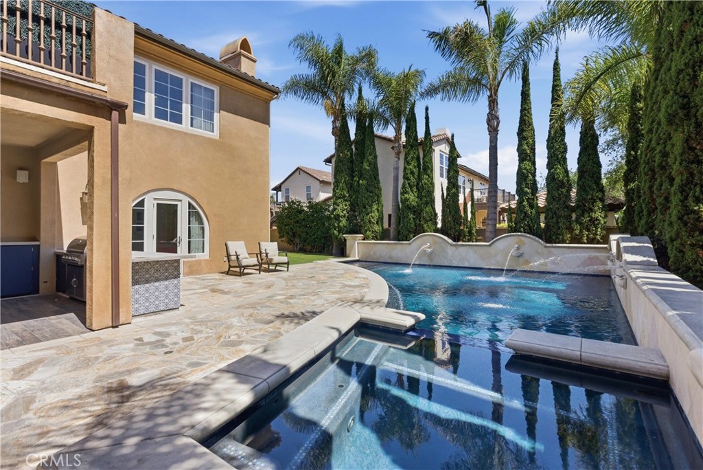 Framed by lush landscaping and hillside views, the backyard creates a private retreat ideal for everything from relaxed - 31491 Carril De Maderas, San Juan Capistrano CA 92675 - photo 28