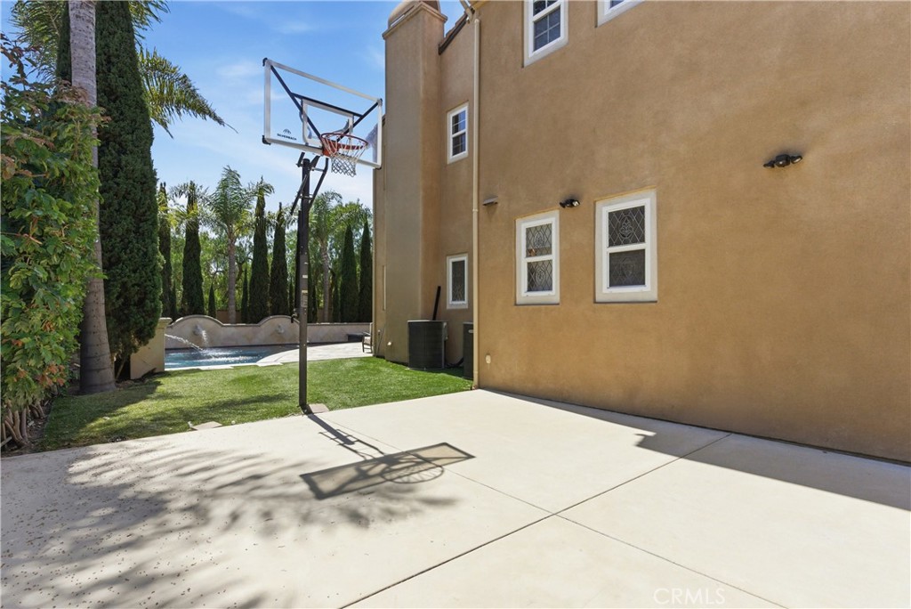 Dedicated sport court area with basketball hoop and additional side yard space - 31491 Carril De Maderas, San Juan Capistrano CA 92675 - photo 33