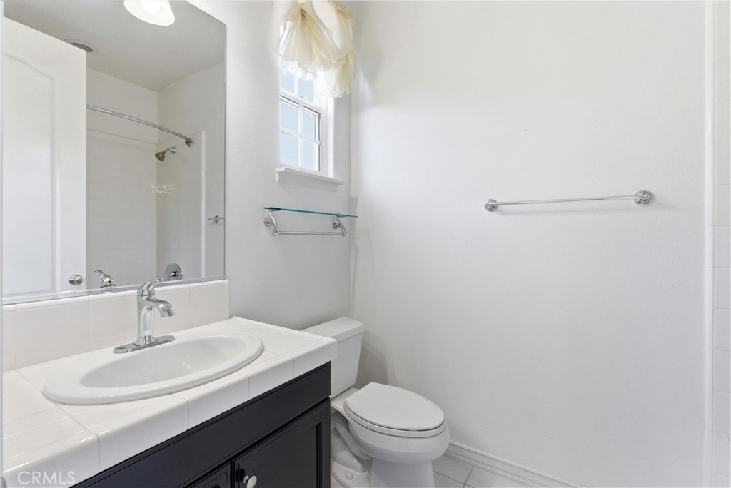 Full bathroom with white tile vanity, tub/shower combination, and accent tile detailing. - 31491 Carril De Maderas, San Juan Capistrano CA 92675 - photo 59
