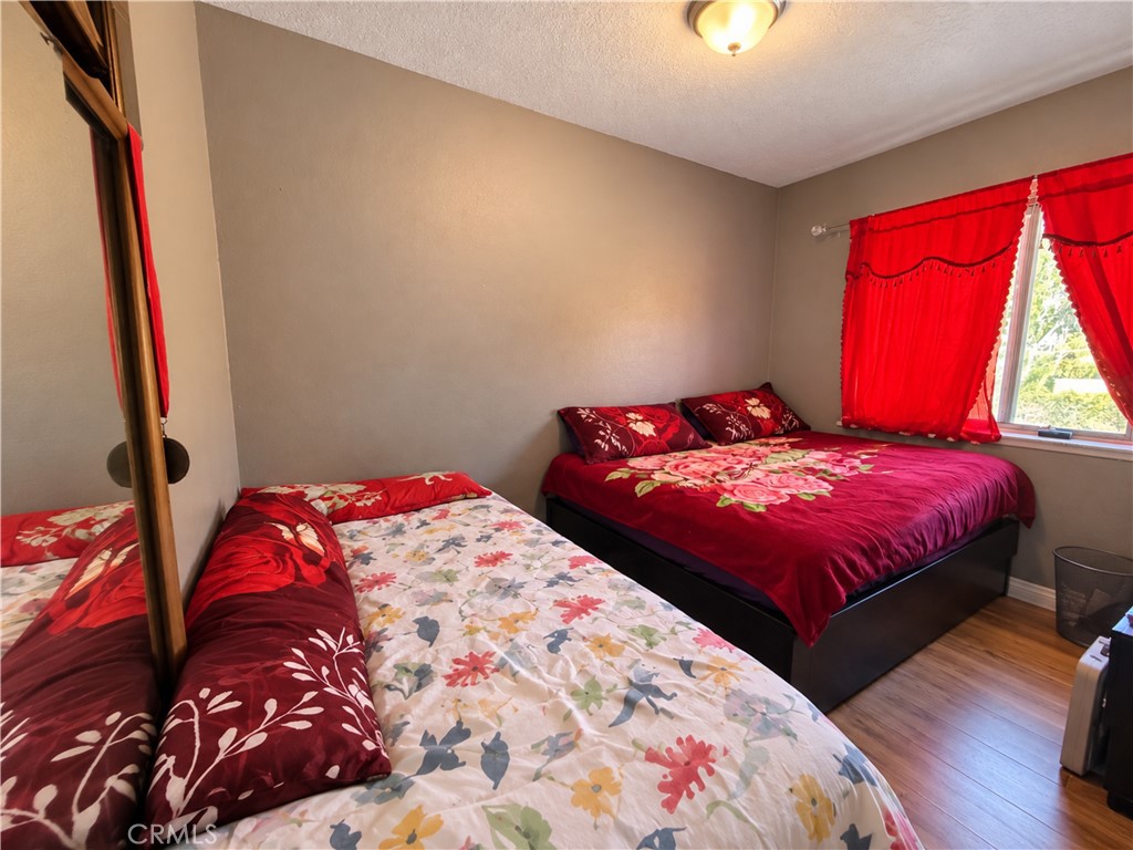 Digitally enhanced, removed clutter. Bedroom 2. Bed 2 and 3 are part of the same room, they just put up a wall - 31608 Los Rios, San Juan Capistrano CA 92675 - photo 6