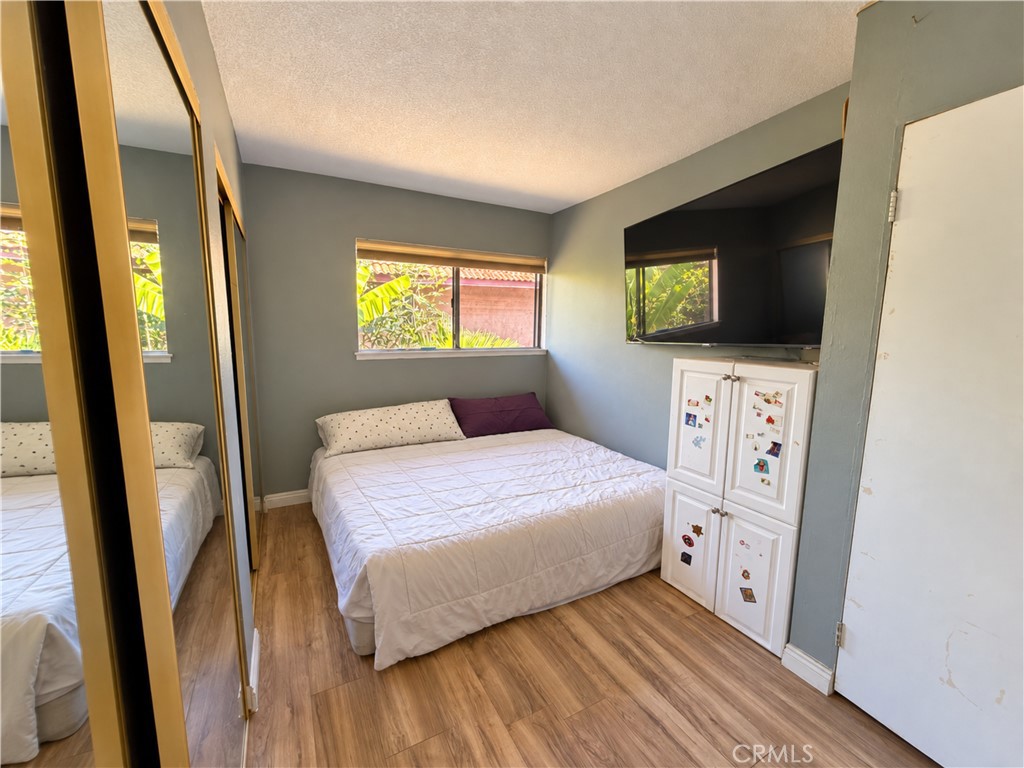 Digitally enhanced, removed clutter. Bedroom 3. Bed 2 and 3 are part of the same room, they just put up a wall - 31608 Los Rios, San Juan Capistrano CA 92675 - photo 7
