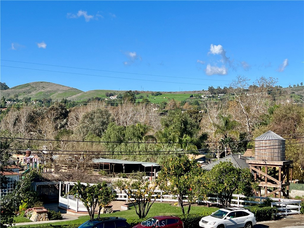 Look to the top of the photo to see how grand the site appears from the heart of town. - 31641 Peppertree Bend, San Juan Capistrano CA 92675 - photo 16