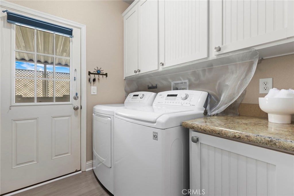 Laundry Room with storage - 32302 Alipaz 292, San Juan Capistrano CA 92675 - photo 20