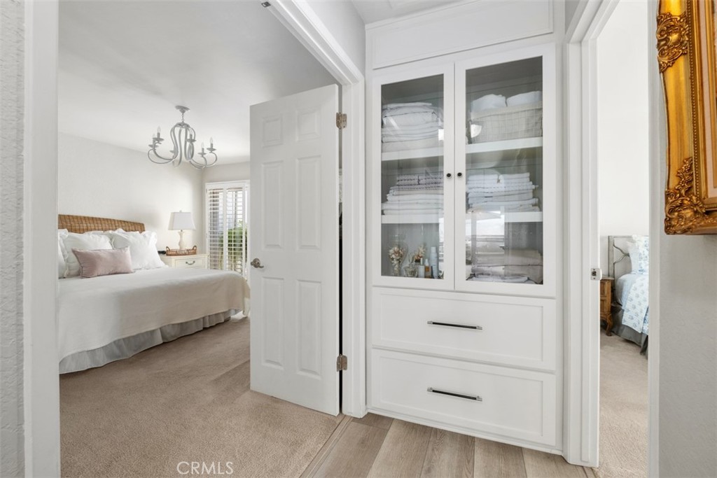 Entry to the main bedroom. Custom designed linen closet. - 32452 Spyglass Court, San Juan Capistrano CA 92675 - photo 18