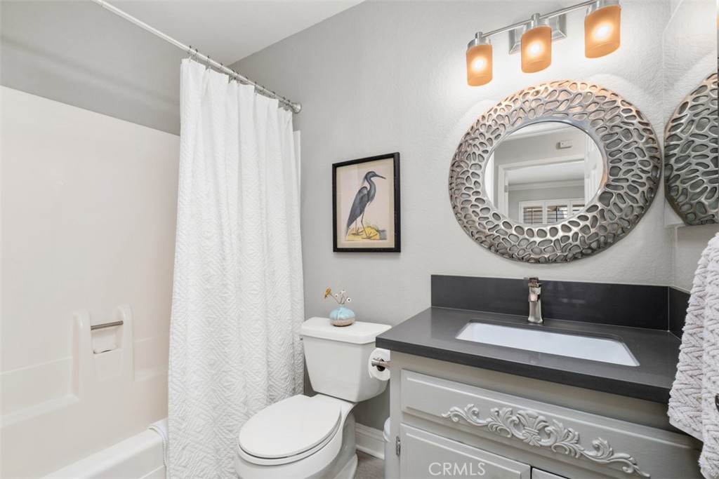Guest bathroom with tub in shower. - 32452 Spyglass Court, San Juan Capistrano CA 92675 - photo 25