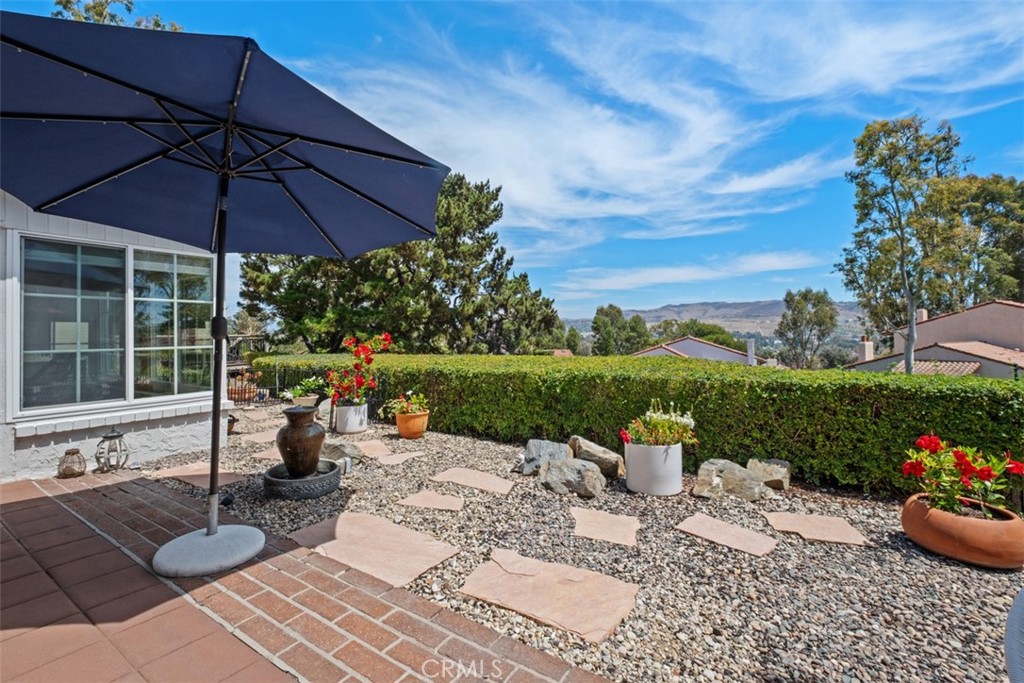 Lovely back patio area with a tranquil water feature and vast views. - 32452 Spyglass Court, San Juan Capistrano CA 92675 - photo 28