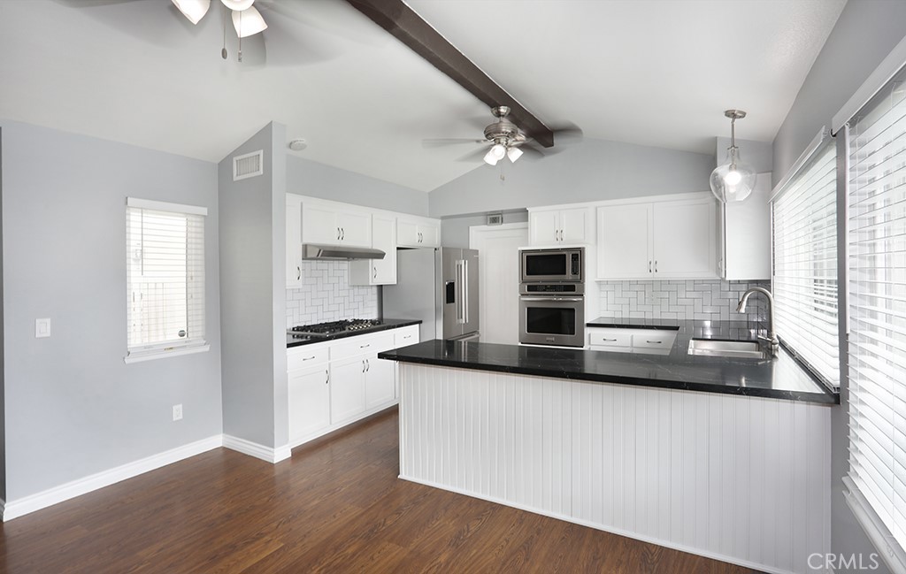 Living room to kitchen - 33031 Driftwood Ct, San Juan Capistrano CA 92675 - photo 5
