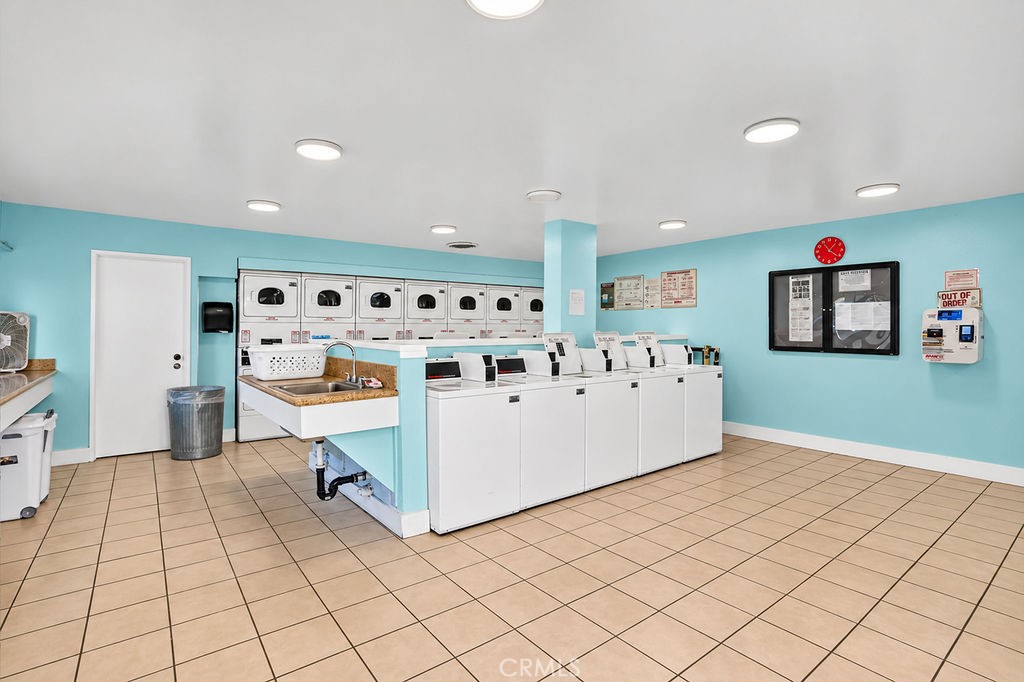 Community laundry room near by. - 1260 Cabrillo Park, Santa Ana CA 92701 - photo 21