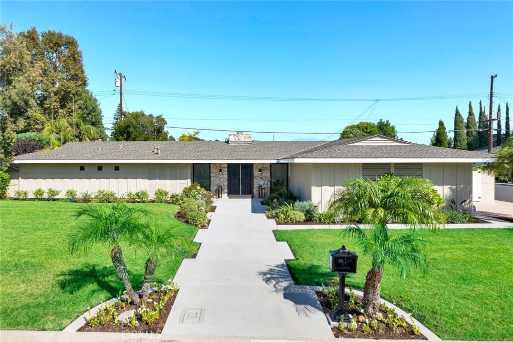 New hardscape and lush landscaping welcome you to 13232 Sandhurst Place! - 13232 Sandhurst Place, Santa Ana CA 92705 - photo 1