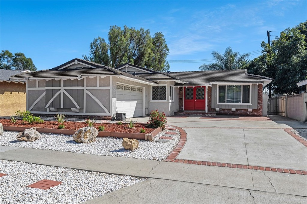 Plenty of parking and convenient drought-resistant low maintenance front yard with Aloe Vera, Graffiti Red Pentas and Dw - 1704 Mcevoy Lane, Santa Ana CA 92706 - photo 1