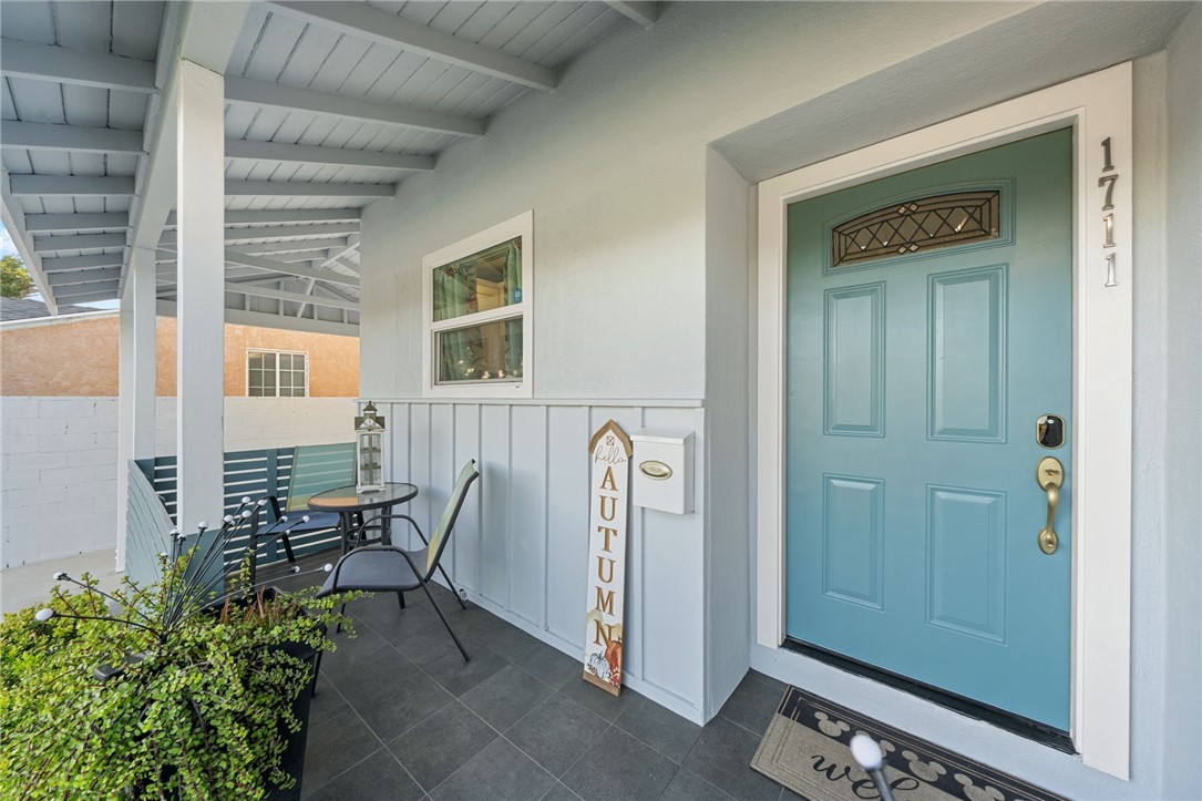 Elevated porch facing south with window kitchen. - 1711 W 21st, Santa Ana CA 92706 - photo 5