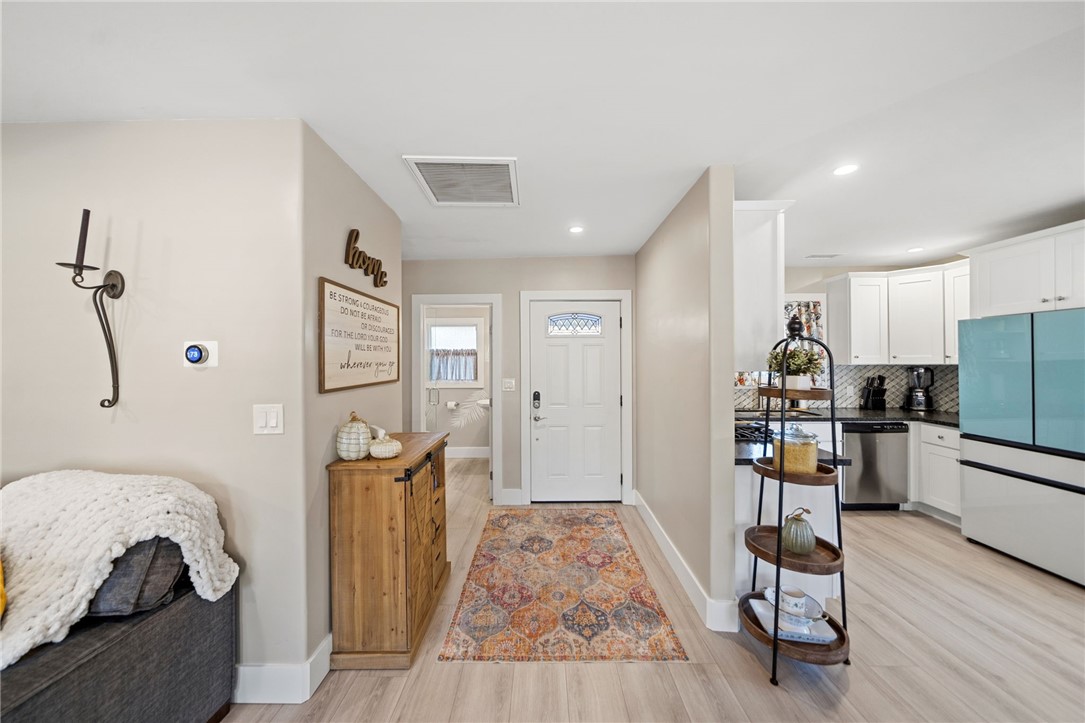 Front door, full bathroom entrance and kitchen. - 1711 W 21st, Santa Ana CA 92706 - photo 12