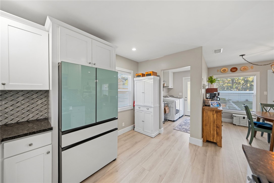 Laundry room is near kitchen. - 1711 W 21st, Santa Ana CA 92706 - photo 17