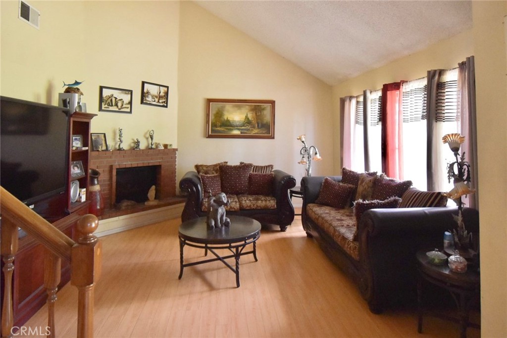 LIVING ROOM WITH HIGH CEILINGS - 1801 PARK GLEN B, Santa Ana CA 92706 - photo 12
