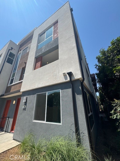 Private Corner Location in rear of community surrounded by block wall and blue skies - 1812 E 1st Street 280, Santa Ana CA 92705 - photo 1