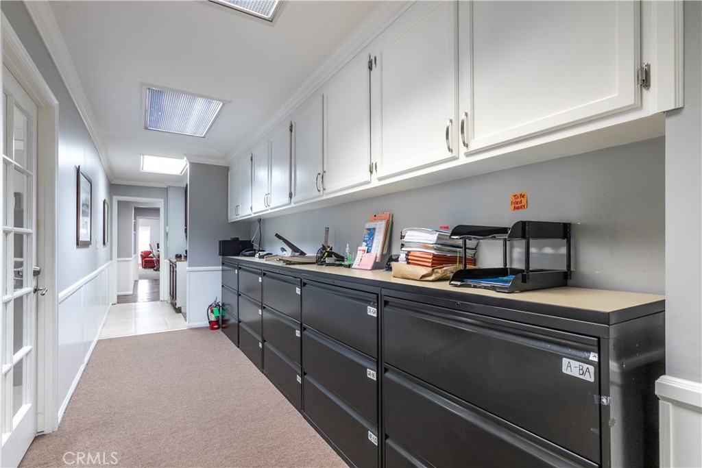 At the end of the tan carpet starts unit 205 which is currentlt being leased by the seller. - 1913 E 17th 204, Santa Ana CA 92705 - photo 13