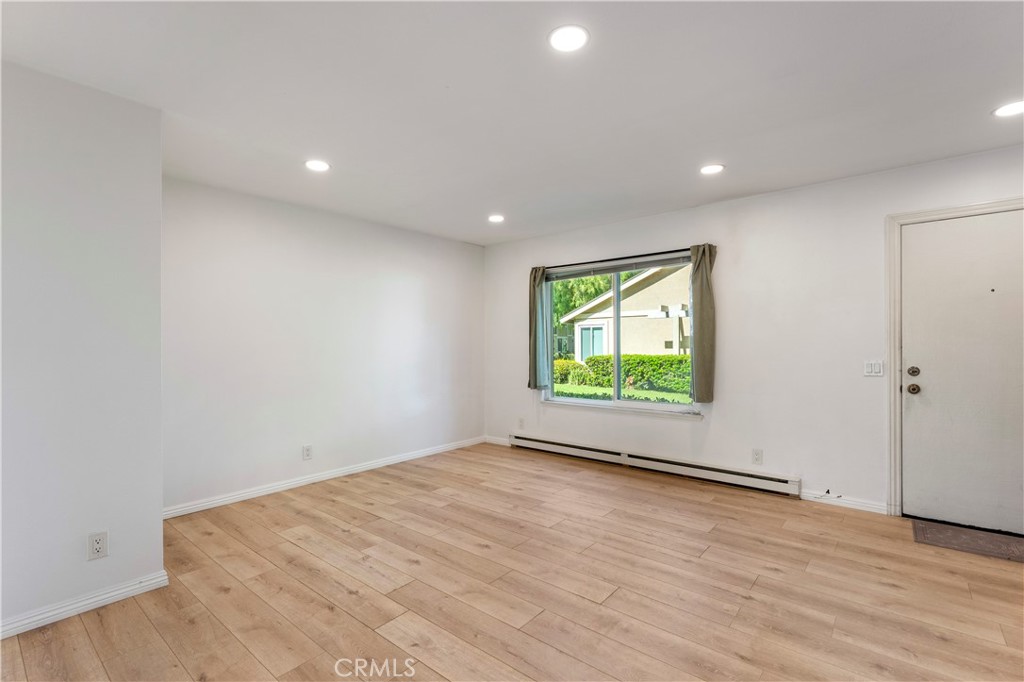 Living Room with LVP Flooring - 210 Carriage B, Santa Ana CA 92707 - photo 3